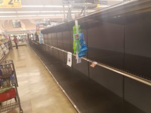 Empty paper goods shelves