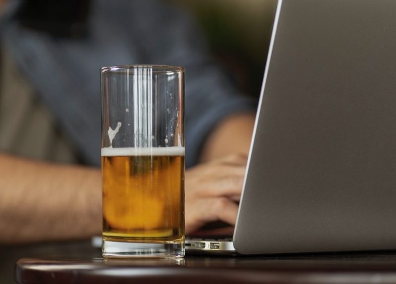Beer next to computer