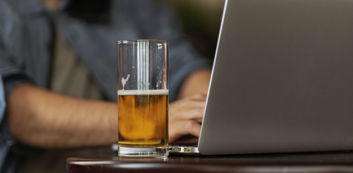 Beer next to computer